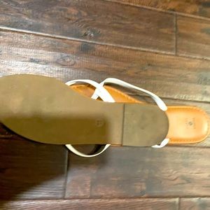 Lightly used sandals with white straps